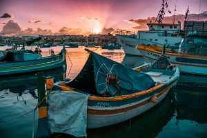 Picture of boats in Malta against setting sun