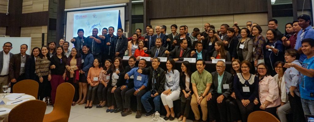 members of the USAID Oceans sitting with their collaborators